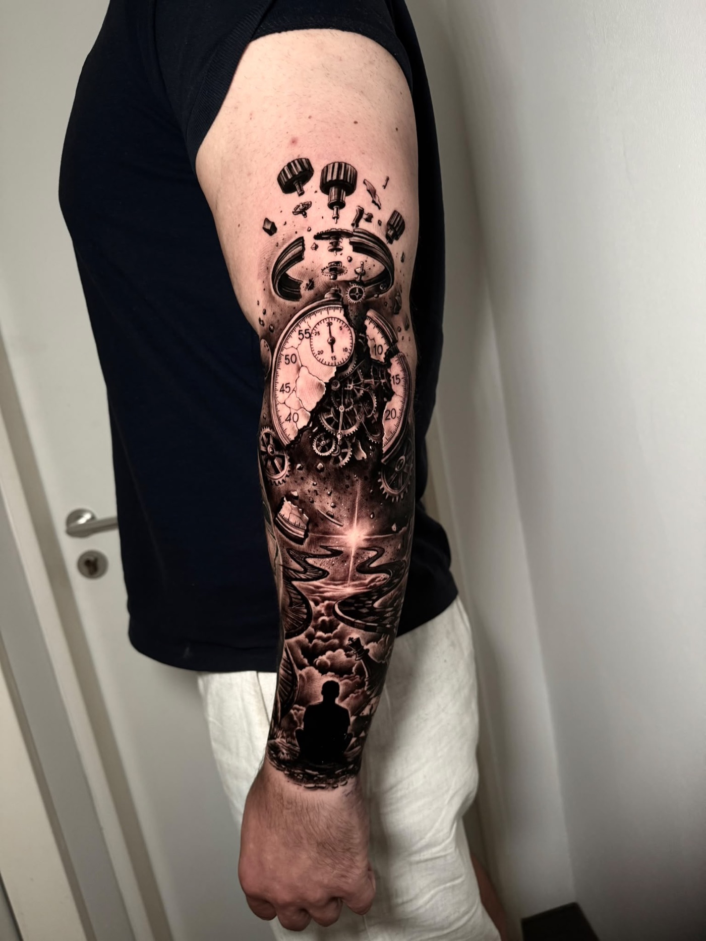 Surreal broken clock full sleeve tattoo