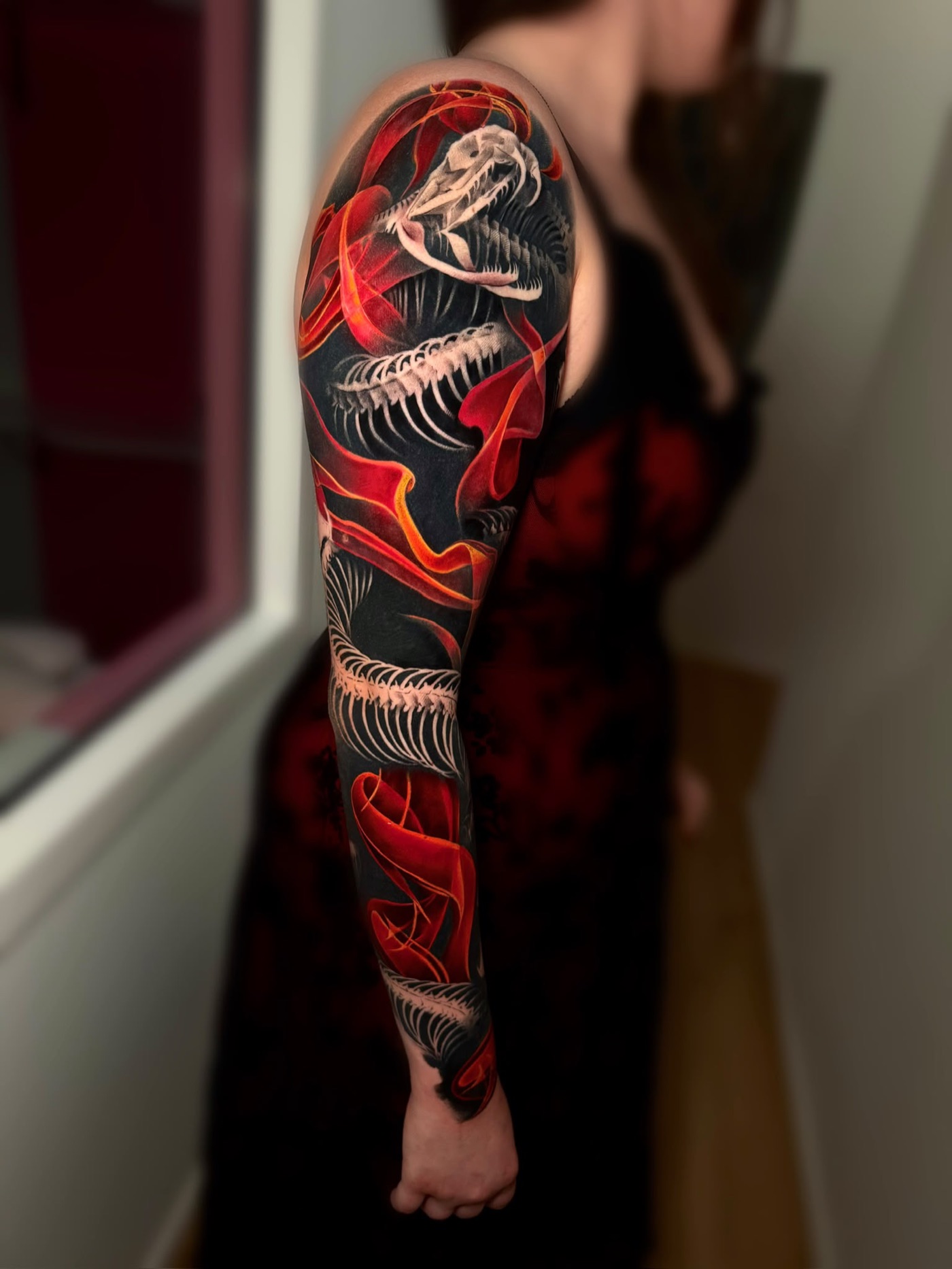 Dinosaur skeleton sleeve with flowing red colour